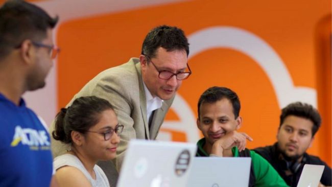 Lecturer teaching students in the Cloud Competency Centre at NCI